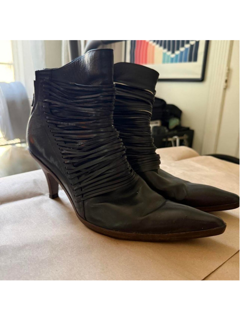 Authentic Dries Van Noten black leather ankle boots featuring an intricate wrapp